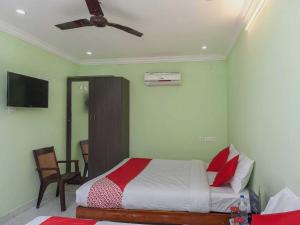 Postel nebo postele na pokoji v ubytování Hotel O Seabreeze Residency