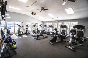 a gym with several treadmills and cardio machines at Mountain Loft Resort - Lake Lure, NC in Lake Lure