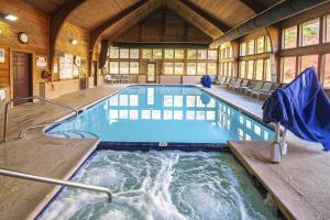 a large swimming pool in a wooden house at Mountain Loft Resort - Lake Lure, NC in Lake Lure