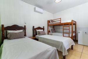 Postel nebo postele na pokoji v ubytování Pousada Coração Verde