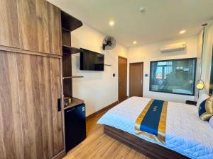 Postel nebo postele na pokoji v ubytování Phi Hùng Hotel