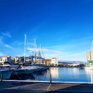 a group of boats are docked in a harbor at Spacious duplex apartment families and couples in Manilva