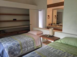 Ένα ή περισσότερα κρεβάτια σε δωμάτιο στο BELLISIMA CASA A 15 minutos de CUERNAVACA