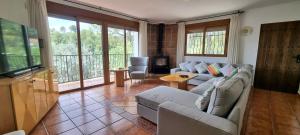 a living room with two couches and a television at Wonderful Villa, Heated Pool, Near Beautiful Town in Alboy