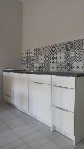 Kuchyň nebo kuchyňský kout v ubytování Allure Loft