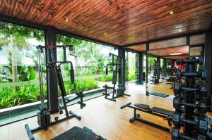 a gym with several treadmills and machines in it at Thai Beach Home Spa: Apto 200m da Praia N605 in Florianópolis