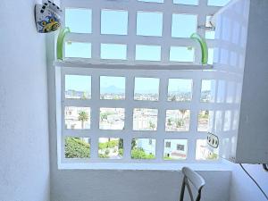 a window with a view of a city at Studio très haut standing avec vue dégagée in Tunis