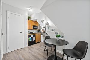 a kitchen with a table and chairs in a room at Highly Recommended Studio Near Times Square in New York +4 photos