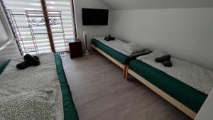 Postel nebo postele na pokoji v ubytování Apartamenty Na Plażowej