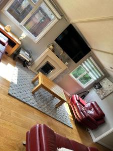 an overhead view of a living room with a table and chairs at Lodge Retreat 8 - Haggerston Castle in Berwick-Upon-Tweed
