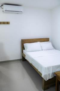 Postel nebo postele na pokoji v ubytování Hotel San Andres Arboletes