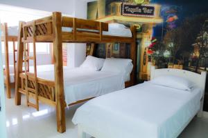 Postel nebo postele na pokoji v ubytování Hotel San Andres Arboletes