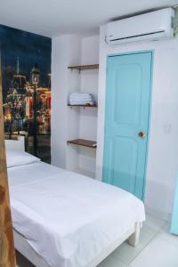Postel nebo postele na pokoji v ubytování Hotel San Andres Arboletes