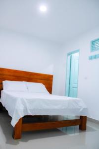 Postel nebo postele na pokoji v ubytování Hotel San Andres Arboletes
