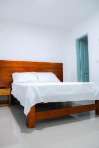 Postel nebo postele na pokoji v ubytování Hotel San Andres Arboletes