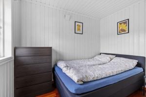 Ένα ή περισσότερα κρεβάτια σε δωμάτιο στο Beautiful house in Risør