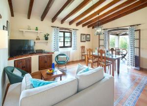 a living room with a couch and a table at Can Pep by Vintage Travel in Pollença