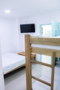 Postel nebo postele na pokoji v ubytování Hotel San Andres Arboletes