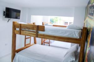 Postel nebo postele na pokoji v ubytování Hotel San Andres Arboletes