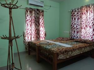 Postel nebo postele na pokoji v ubytování SEVENSTAR RESIDENCY