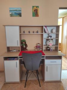 a desk with a chair in a room at Apartman Yuriel - Sea View in Rijeka