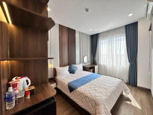Postel nebo postele na pokoji v ubytování Phi Hùng Hotel
