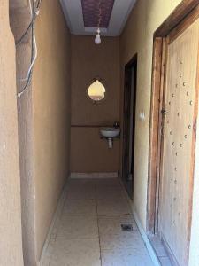 an empty bathroom with a sink and a window at da housa hostel in Tahliouine +58 photos