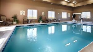 a large swimming pool in a hotel room at Best Western Plus Carousel Inn & Suites Burlington in Burlington