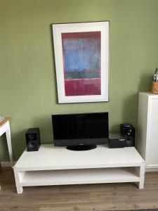 TV a/nebo společenská místnost v ubytování Ferienwohnung Woldemar
