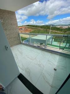 a view from the top of a building with marble floors at Flat no Cond Home Duplex - Subida da Serra in Bezerros