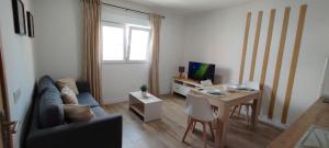 a living room with a couch and a table at Gran Canaria - Casa Carmen (Vecindario) in Vecindario +68 photos