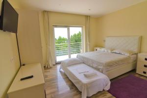 Postel nebo postele na pokoji v ubytování Guest House Manuela