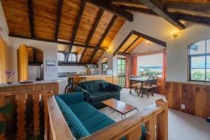 a living room with a couch and a table at Manapouri Holiday Park in Manapouri