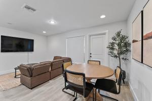 a living room with a table and a couch at October Special! Limited-time Discount Book Now! in West Palm Beach