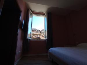 Postel nebo postele na pokoji v ubytování Casa nel borgo di Capraia