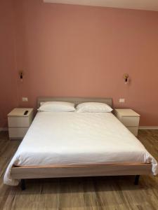 Postel nebo postele na pokoji v ubytování Casa nel borgo di Capraia