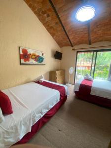 Postel nebo postele na pokoji v ubytování Hotel Villas Ajijic, Ajijic Chapala Jalisco + 37 fotografií