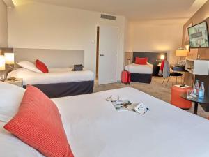 Postel nebo postele na pokoji v ubytování Best Western Plus Metz Technopole