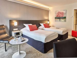 Postel nebo postele na pokoji v ubytování Best Western Plus Metz Technopole