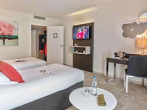 Postel nebo postele na pokoji v ubytování Best Western Plus Metz Technopole