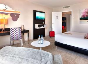 Postel nebo postele na pokoji v ubytování Best Western Plus Metz Technopole
