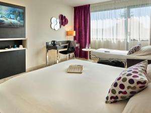 Postel nebo postele na pokoji v ubytování Best Western Plus Metz Technopole