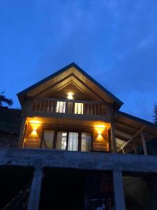 a house with lights on the top of it at Villa Klodi in Boge +4 photos