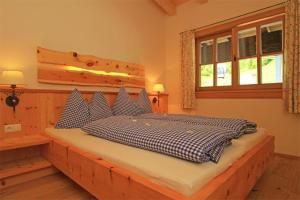 Postel nebo postele na pokoji v ubytování Ferienhaus Loderbichl