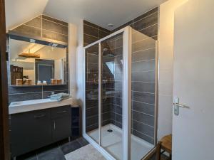 a bathroom with a shower and a sink at Suite Familiale Privatisée avec Petit Déjeuner, Salon et Chambres au 1er Étage - FR-1-591-396 in Châteauroux +16 photos
