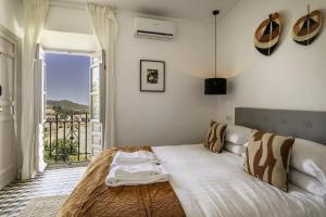 Postel nebo postele na pokoji v ubytování Casa Jardin Competa