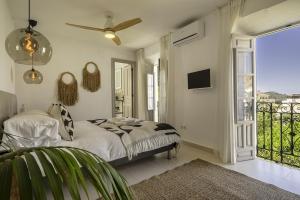 Postel nebo postele na pokoji v ubytování Casa Jardin Competa