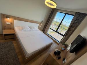 Ένα ή περισσότερα κρεβάτια σε δωμάτιο στο Hotel Luxor +9 φωτογραφίες
