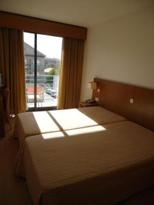 Cama ou camas em um quarto em Hotel Jose Alberto