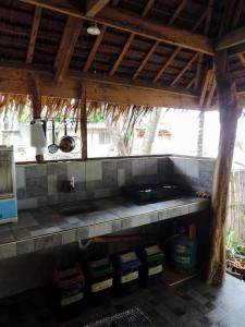 a kitchen with a stove and a counter top at Goldsky Seaview Resort in San Juan